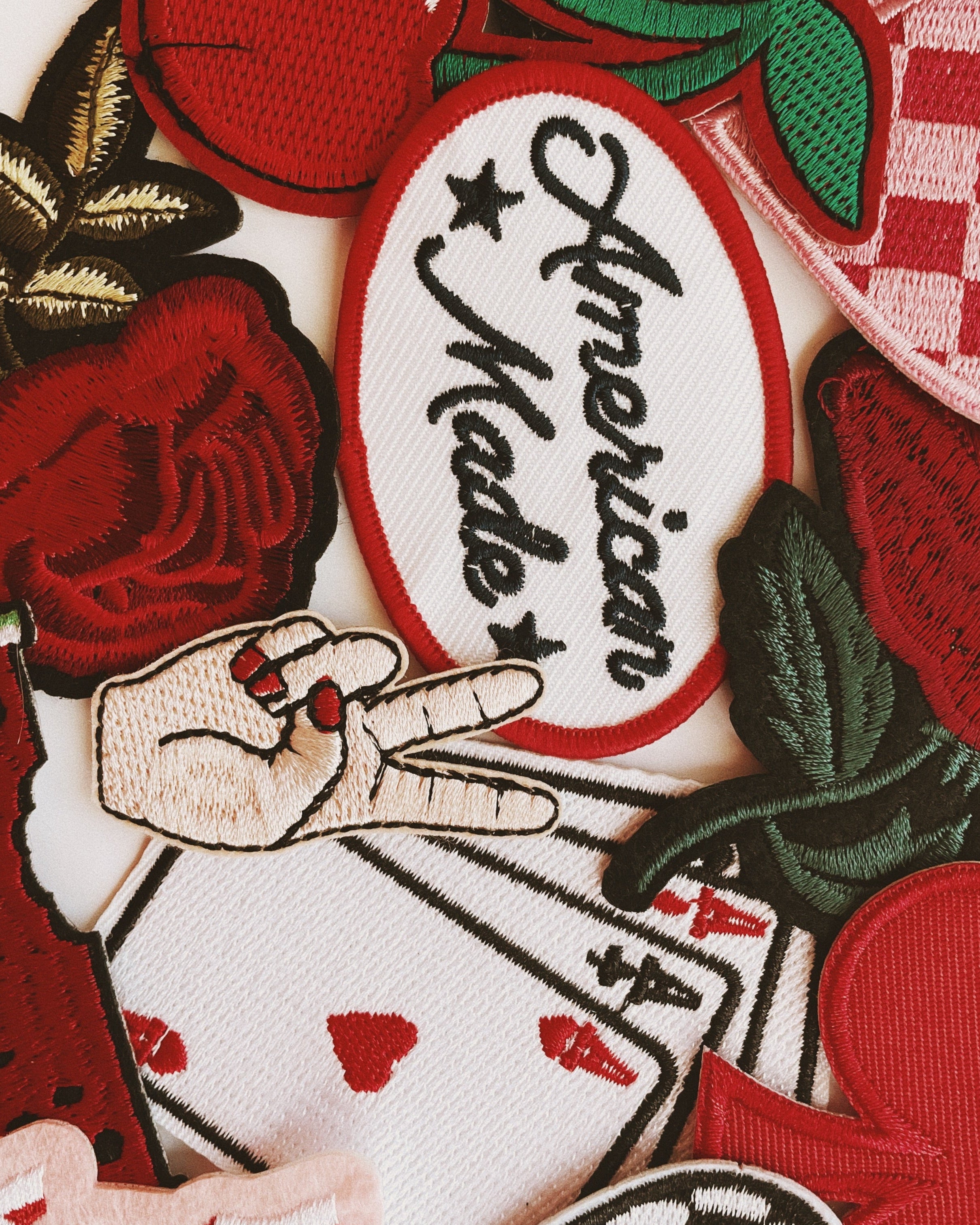 Collection of various embroidered patches with different designs and text.